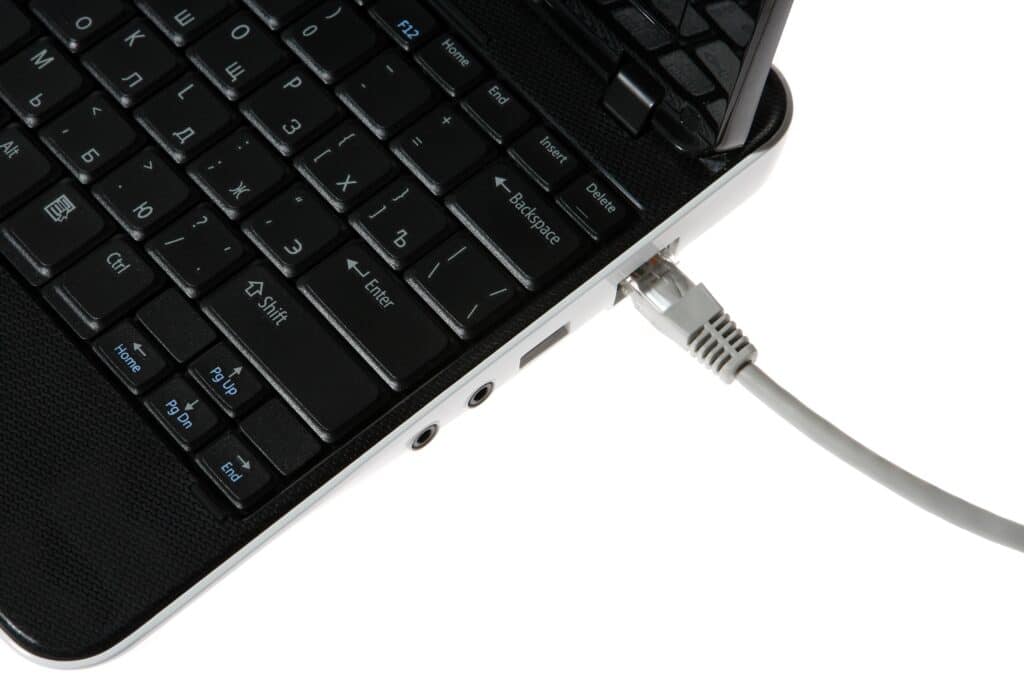 USB port on laptop laptop with a cable internet on the white background